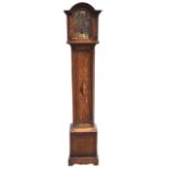A William & Mary style oak grandmother clock with arched cornice and brass dial with roman chapter
