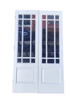 A pair of painted French doors with astragal glazed panels fitted with bevelled panes above
