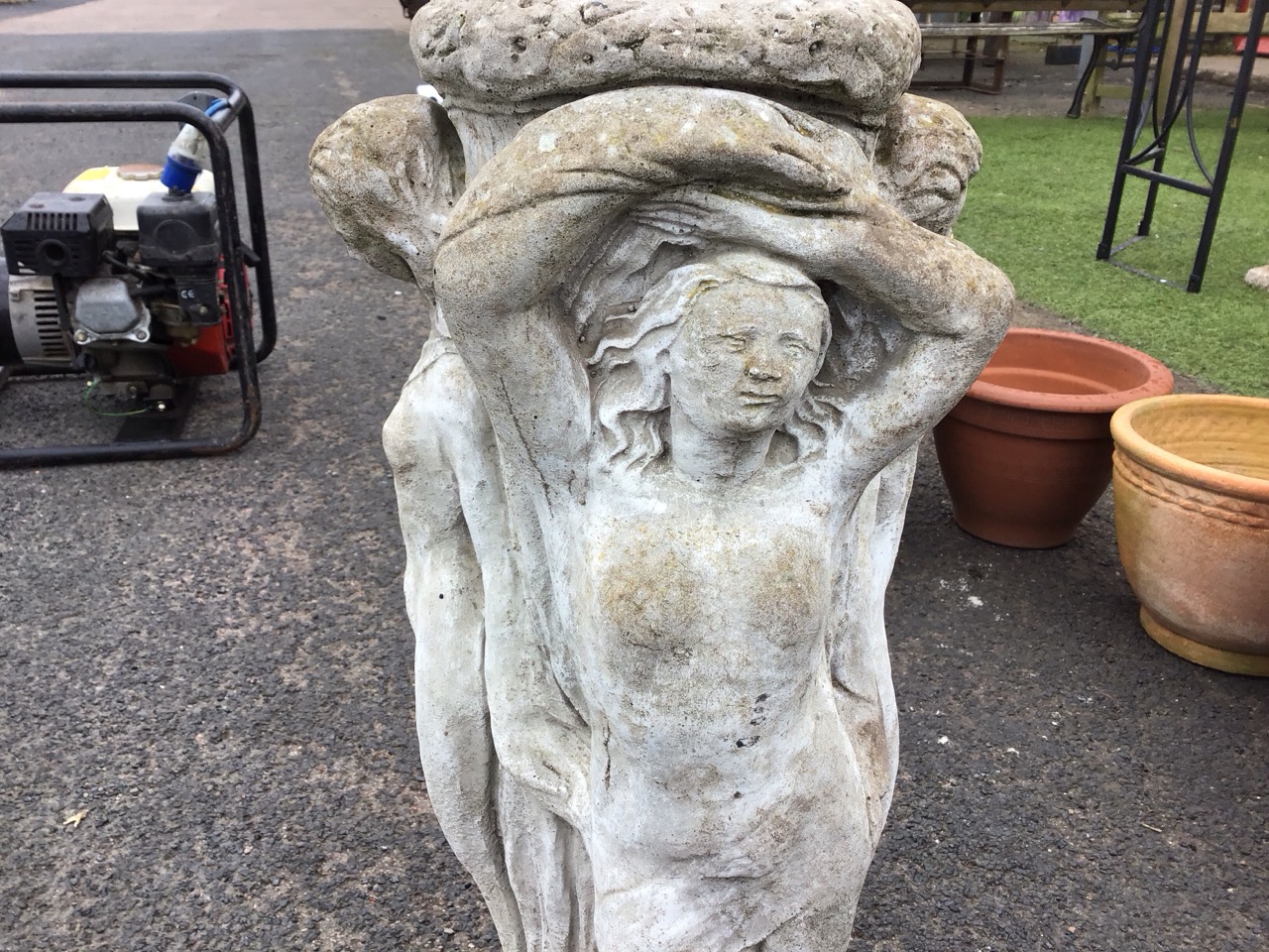 A composition stone birdbath support cast as three ladies around a flower encrusted column, on - Image 3 of 3