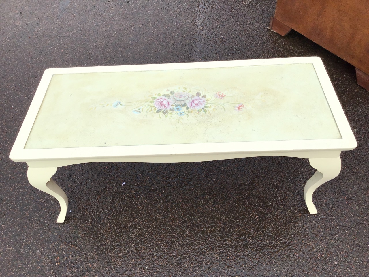 A painted coffee table with rectangular top decorated with a floral spray under glass, above a - Image 2 of 3