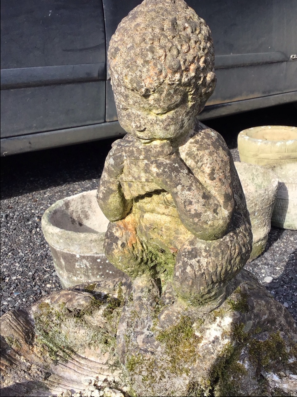 A composition stone garden birdbath cast as a shell with panpipe boy to rim, the square moulded - Image 3 of 3