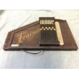 A German autoharp - Traviato, with chord levers to stringed instrument with ebonised case, with