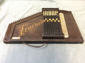 A German autoharp - Traviato, with chord levers to stringed instrument with ebonised case, with