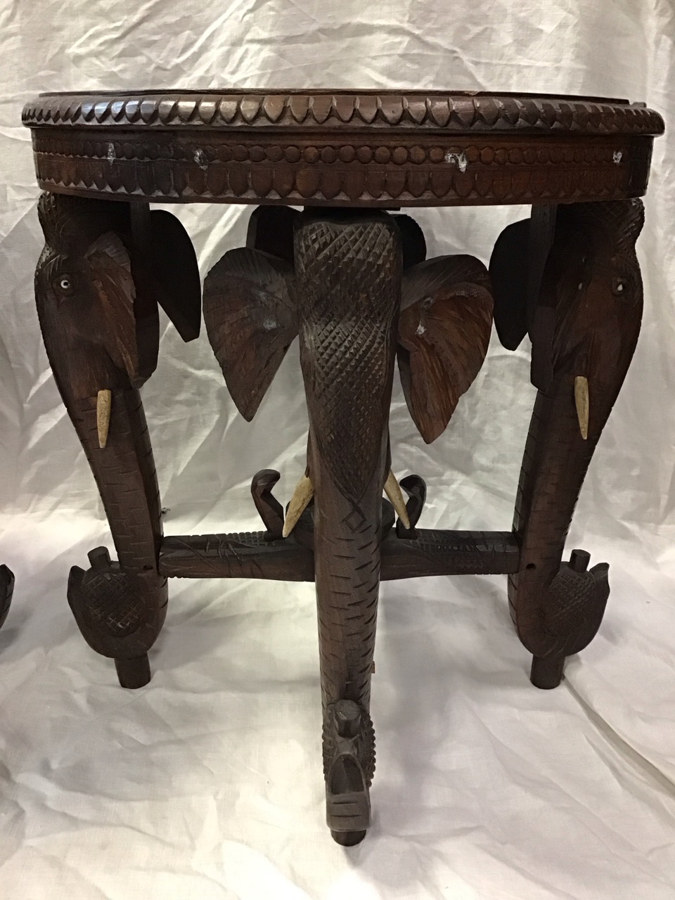 A pair of Indian carved hardwood occasional tables with circular tops inlaid with elephants, - Image 2 of 3