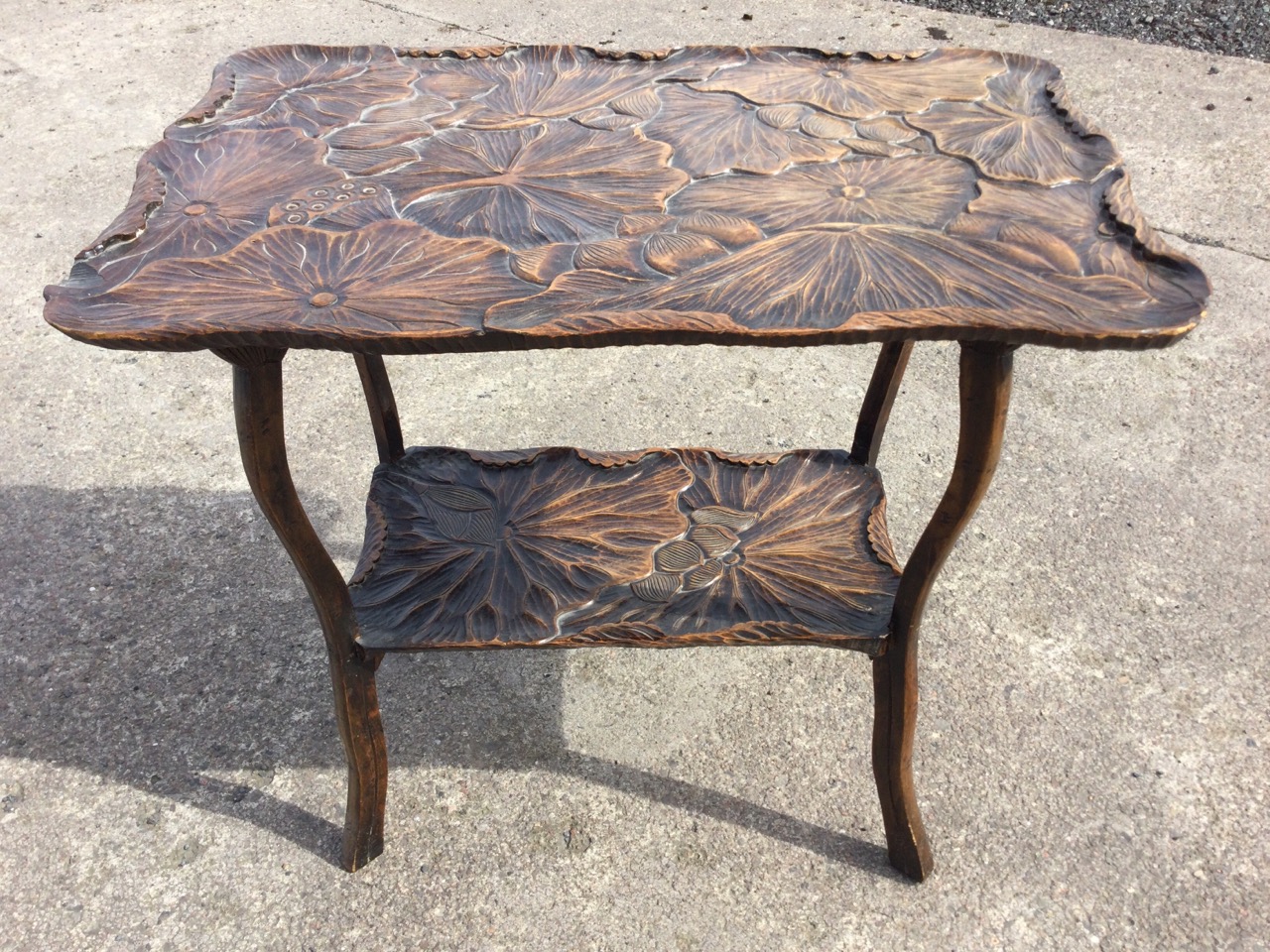 An early C20th Japanese hardwood occasional table with shaped rectangular top carved with lotus pads - Image 3 of 3