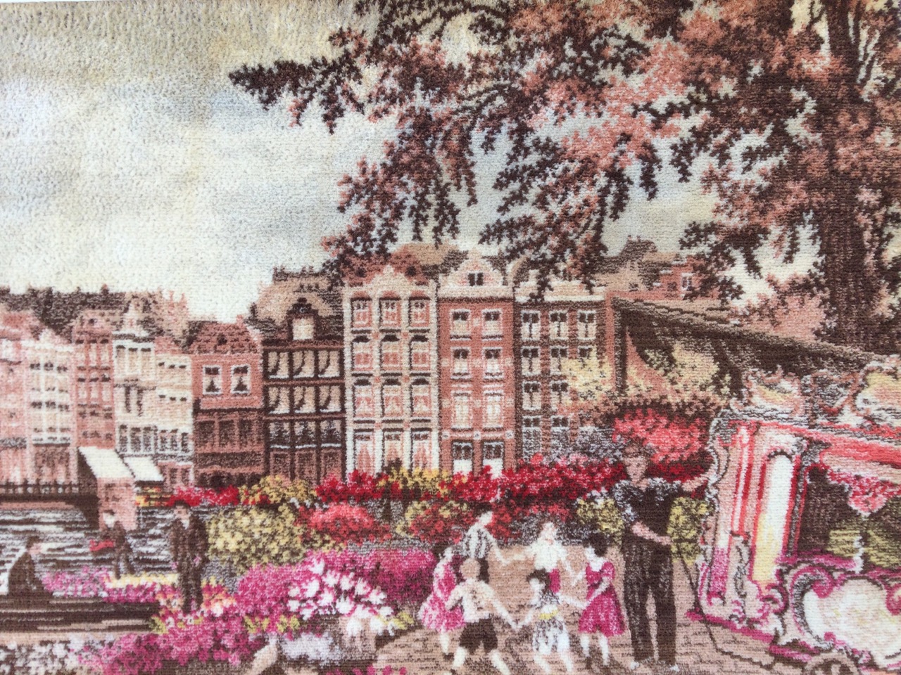 A framed rectangular woolwork tapestry of a Dutch city with flower sellers by waterside - Bruges? ( - Image 2 of 3
