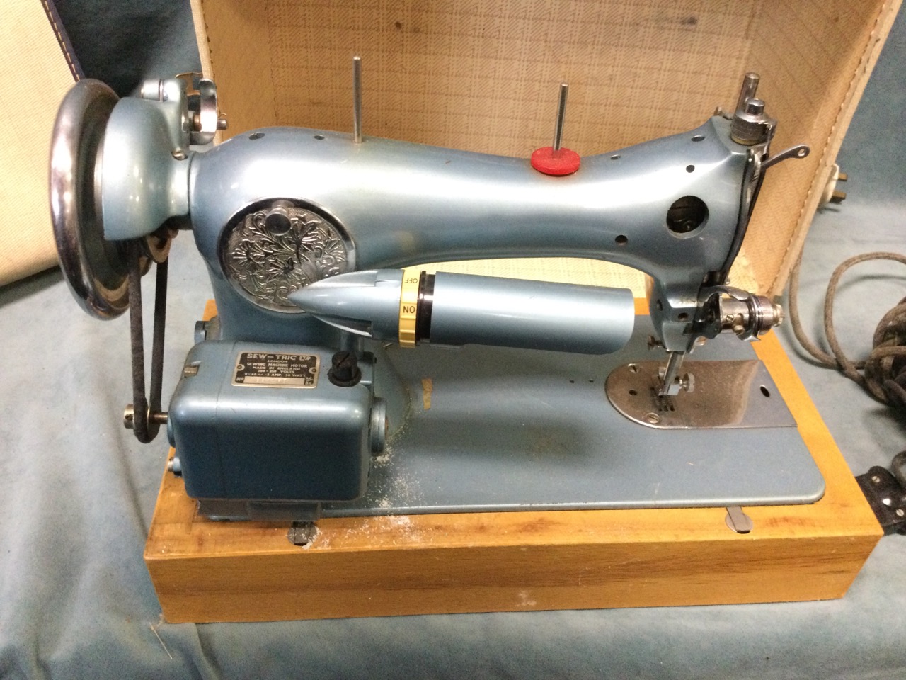 A 50s cased Atlas electric portable sewing machine, with bakelite foot pedal on a beech base, the - Image 2 of 3