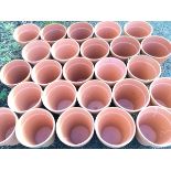 Twenty-five terracotta tapering plant pots with moulded rims. (12.25in) (25)