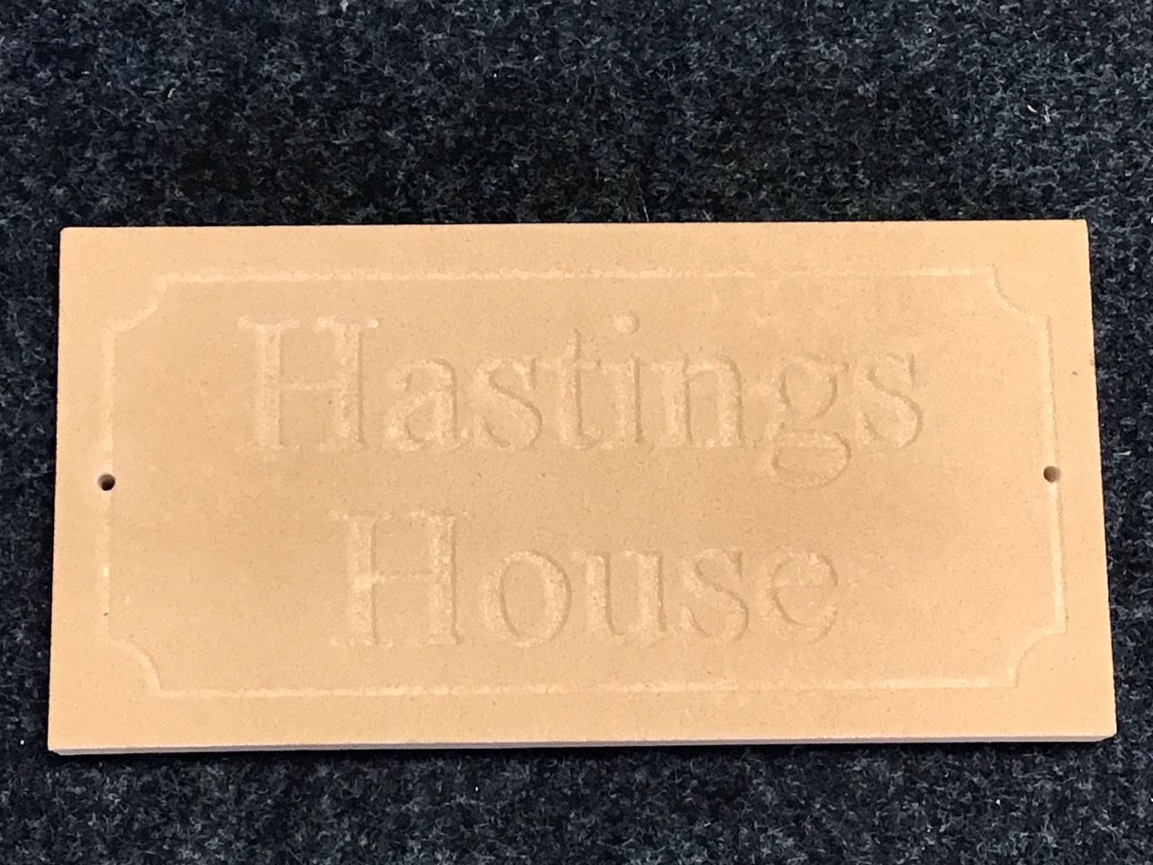 A sandstone slab carved with house name in panel - Hastings House. (15.75in x 8in)
