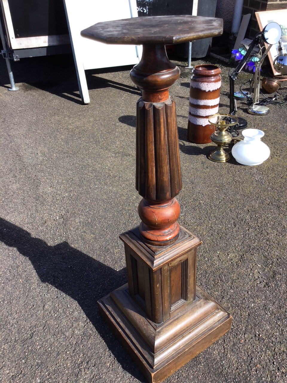 A Victorian jardiniere stand with octagonal platform on turned and fluted column above a panelled - Image 2 of 3