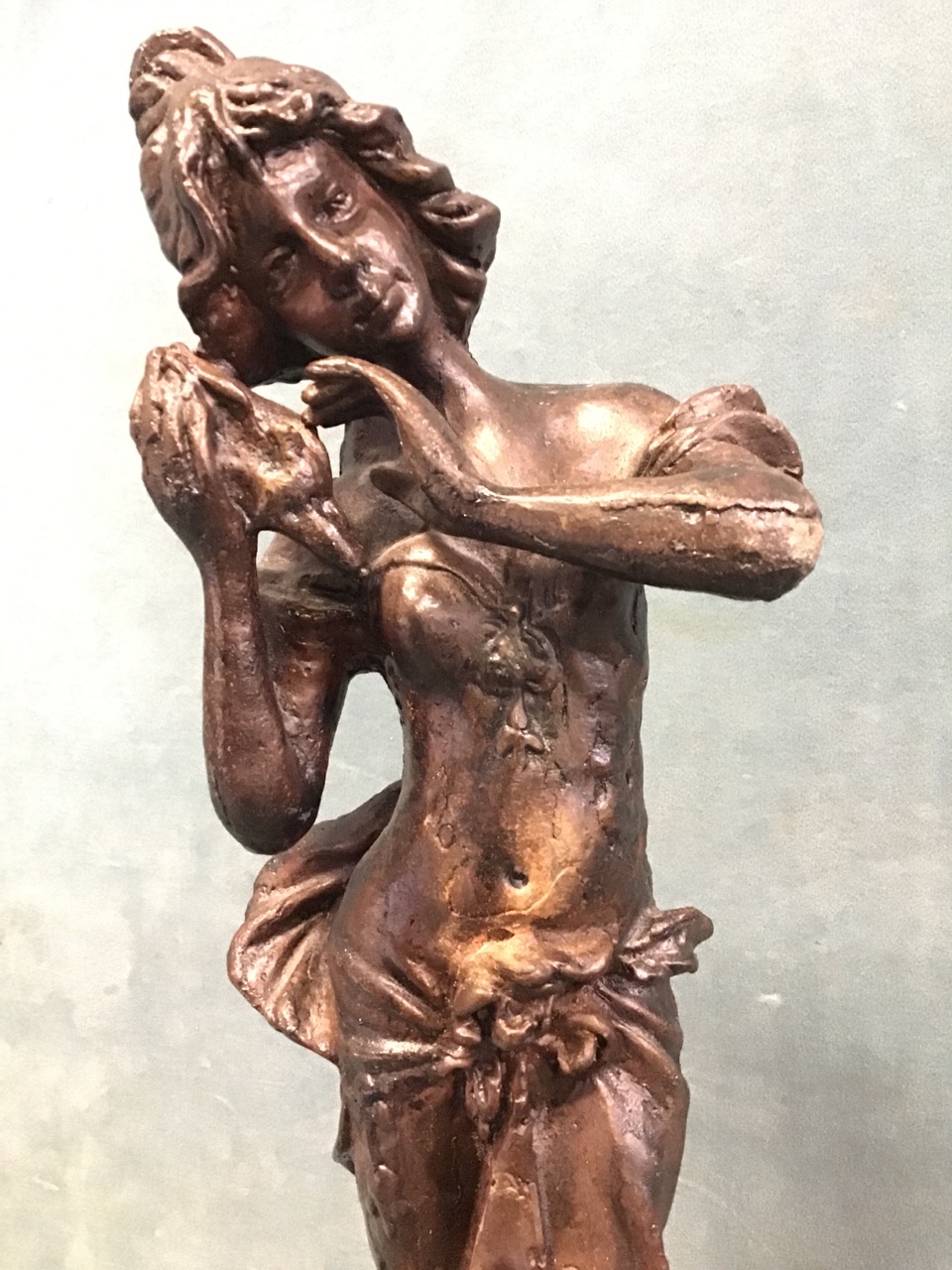 A cast iron figure with bronze patination depicting a classically draped lady listening a - Image 2 of 3