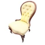 A Victorian mahogany upholstered spoonback chair with buttoned back above a serpentine fronted seat,