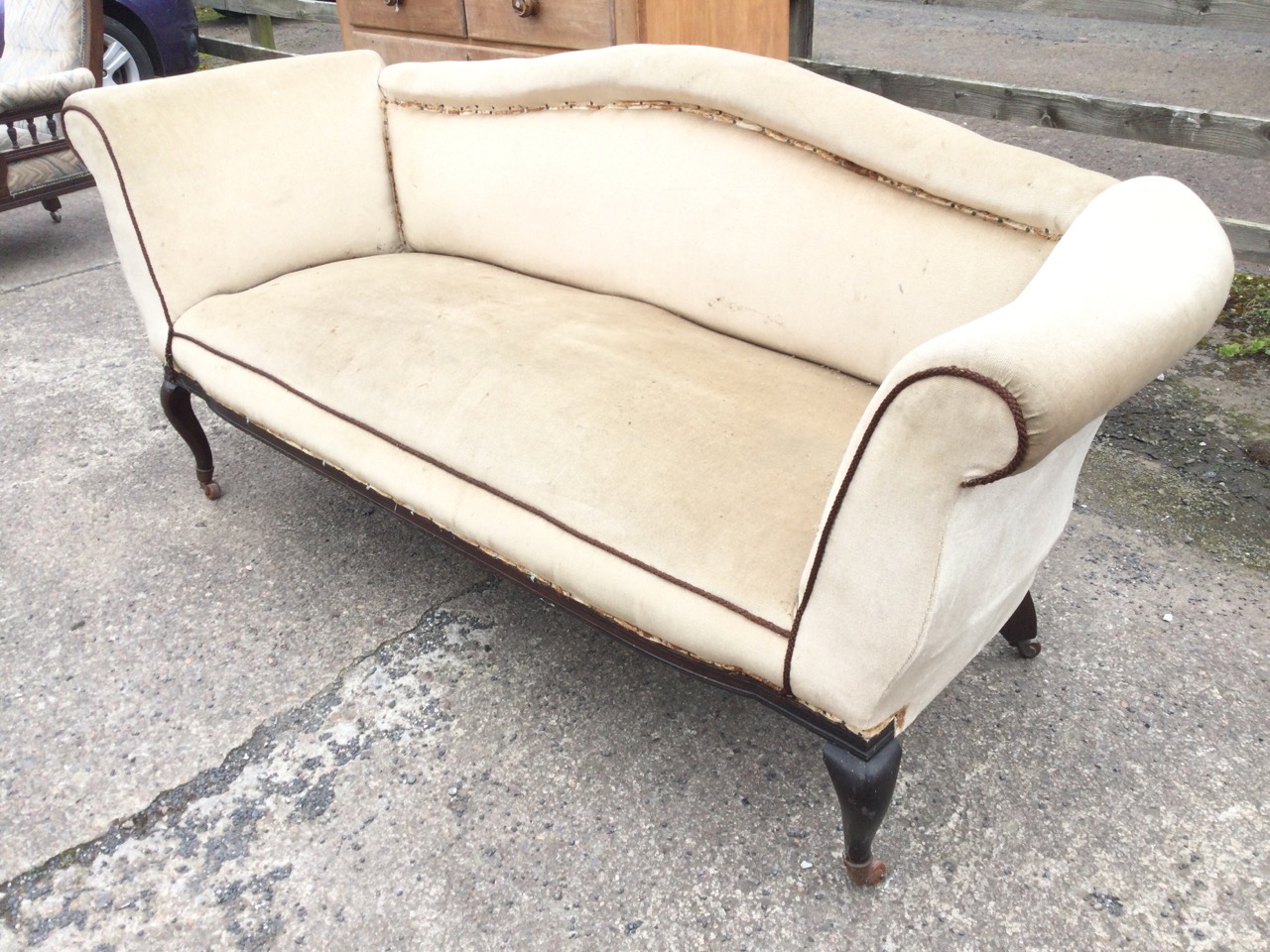 An Edwardian upholstered sofa with arched rolled back and rectangular sprung seat flanked by - Image 2 of 3