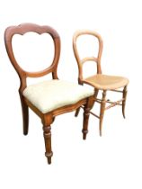 A Victorian mahogany balloon back chair with drop-in upholstered seat, raised on turned tapering