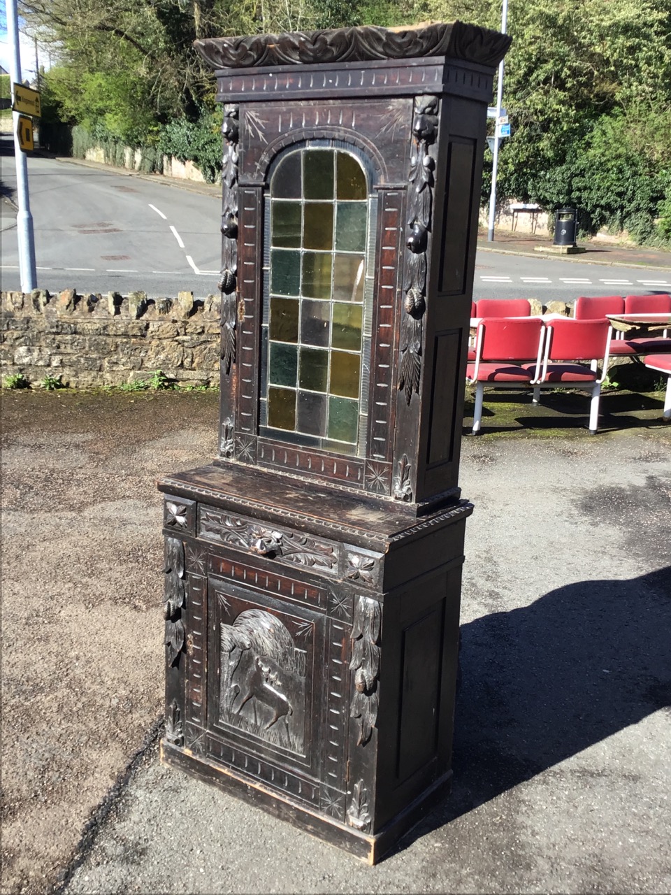 A Victorian oak carved cabinet with leaf carved cornice above an arched leaded glass door flanked by - Image 3 of 3