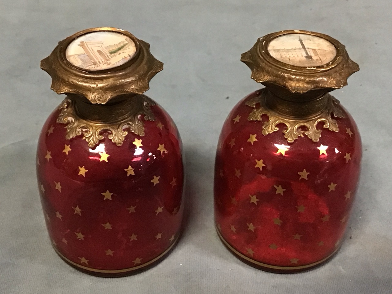 A pair of Victorian cranberry glass Palais Royal scent bottles of domed form having giltmetal - Image 3 of 3