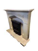 A faux limestone chimneypiece with rectangular mantlelshelf above a gothic shaped moulded aperture