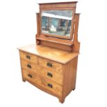 A Victorian burr oak dressing table by Robson & Sons with rectangular bevelled mirror on shaped