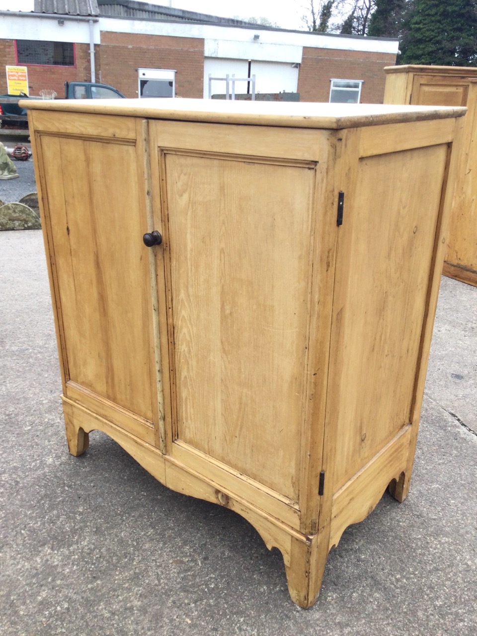 A Victorian pine cupboard with moulded panelled doors above a shaped apron, raised on bracket - Image 3 of 3