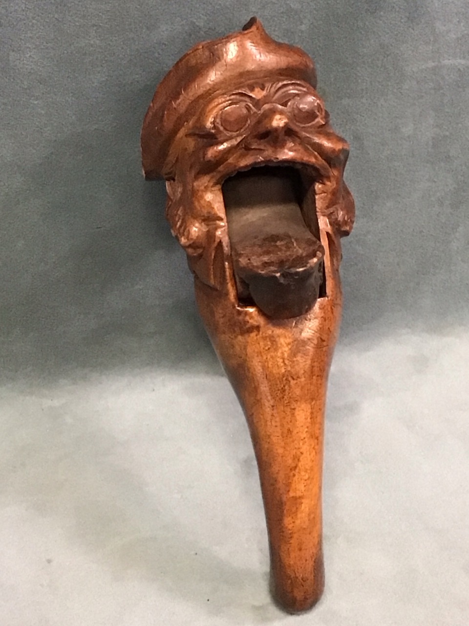 A C19th Swiss carved walnut nutcracker in the form of a comical old man wearing a tricorn hat and - Image 2 of 3