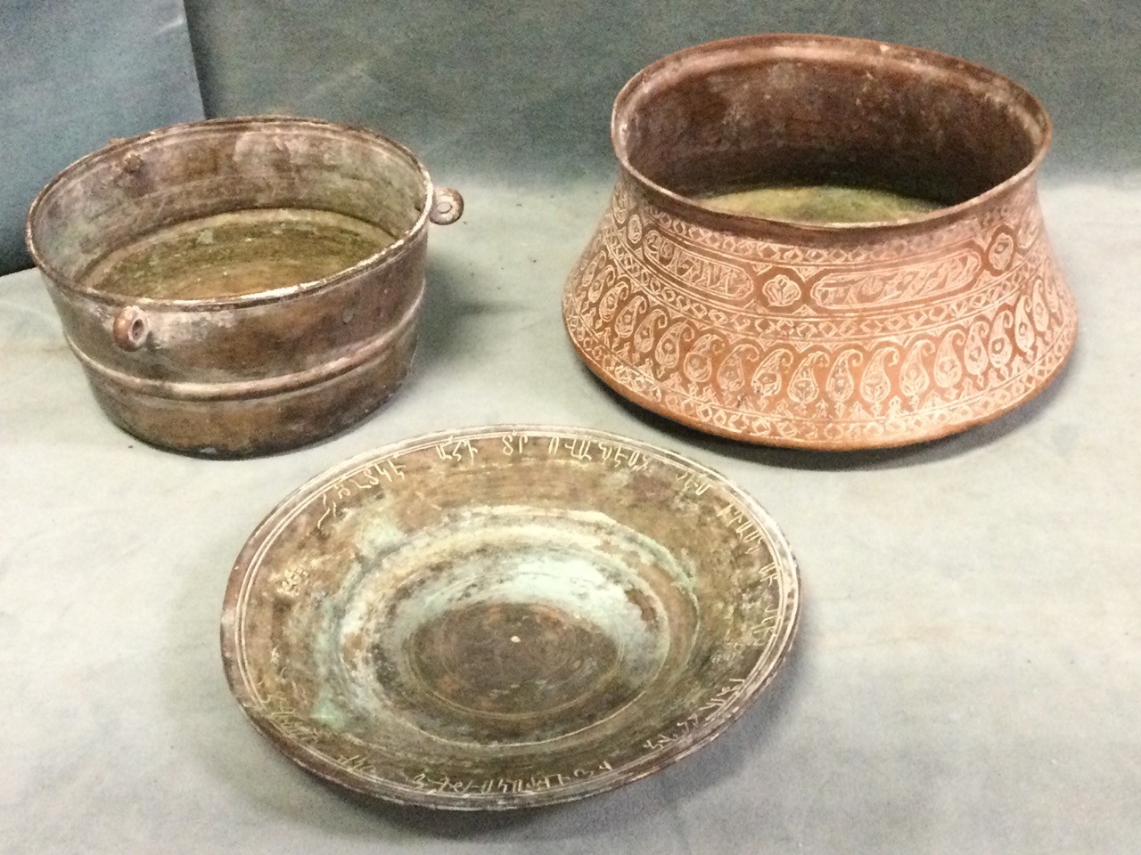 Three ancient Iranian copper vessels with Islamic decoration; four copper cooking moulds; and an - Image 3 of 3