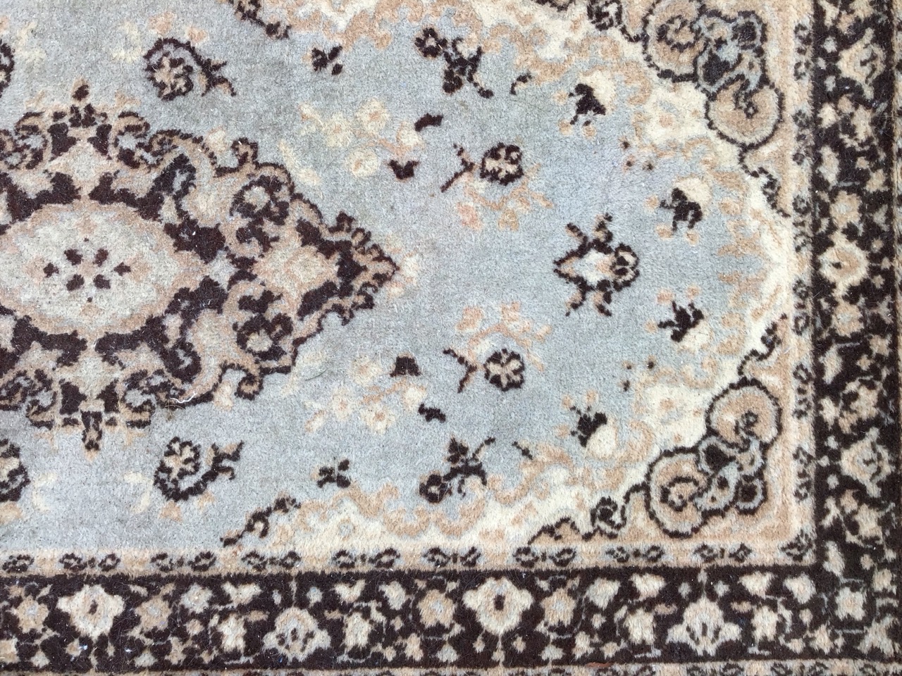 A Kashmir style wool rug with central scrolled medallion on a pale blue ground with conforming - Image 3 of 3