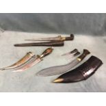 A Ghurka kukri, chakmak & karda knives with horn handles, brass fittings & leather faras sheath;