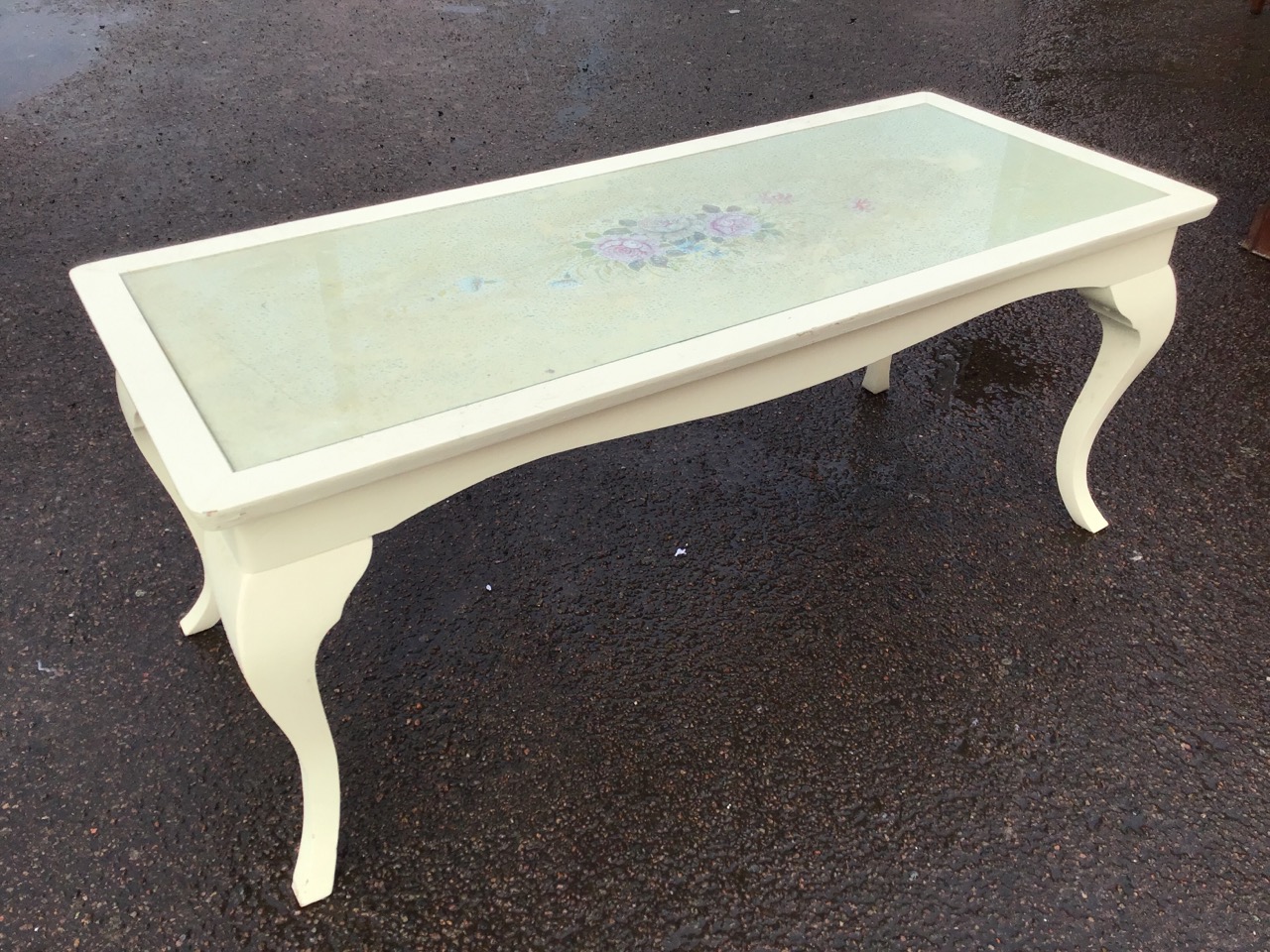 A painted coffee table with rectangular top decorated with a floral spray under glass, above a - Image 3 of 3