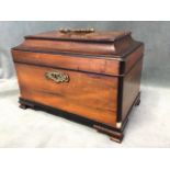 A George III ebony moulded mahogany tea caddy with cavetto moulded cover, fitted with brass swan-
