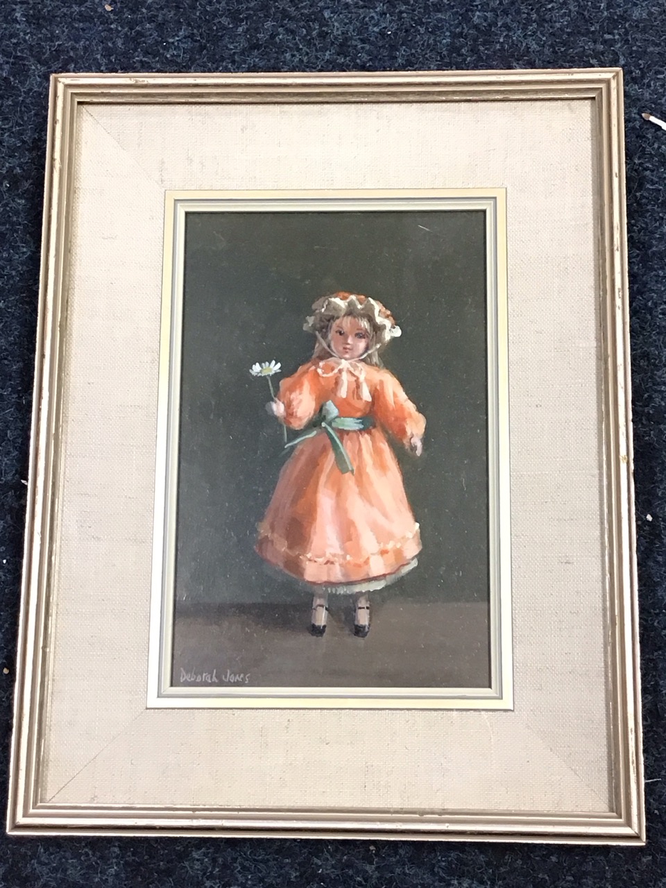 Deborah Jones, oil on board, a Victorian doll holding a daisy, signed, titled Amanda on gallery