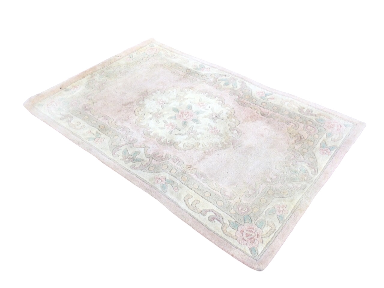 A Chinese wool rug woven in pastel floral shades with central circular medallion on pink field