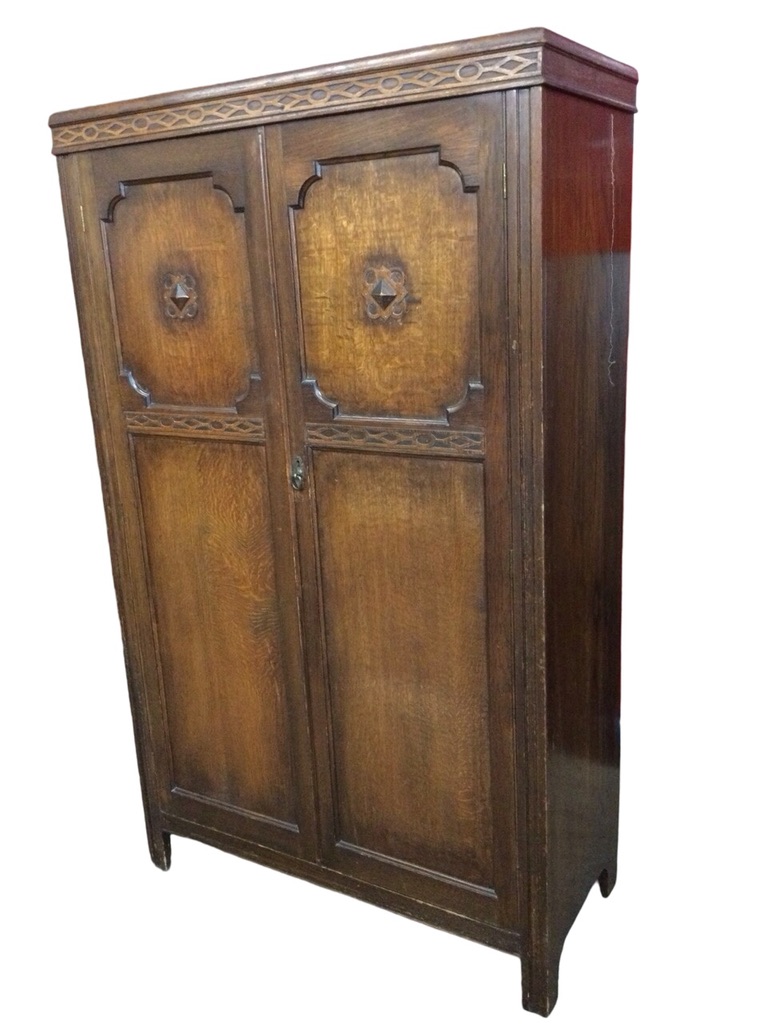 A 1930s oak compactum by Joel Galleries having fitted interior with compartments, drawer, rails &