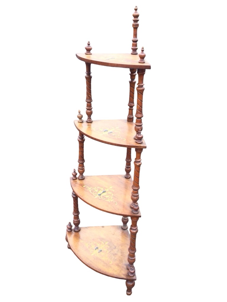 A Victorian walnut four-tier corner whatnot with inlaid scrolled decoration to bowfronted shelves,