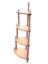 A Victorian walnut four-tier corner whatnot with inlaid scrolled decoration to bowfronted shelves,