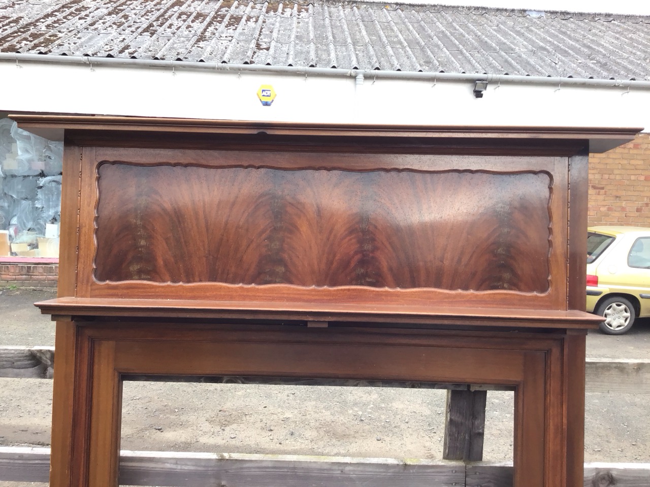 An Edwardian mahogany chimneypiece with moulded rectangular mantleshelf above a scalloped panel, - Image 3 of 3