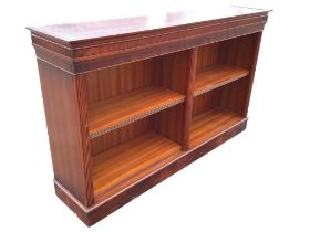 A Georgian style mahogany open bookcase with moulded ribbed cornice above two compartments with