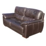 A contemporary Violino leather two-seater sofa, the rectangular back and seat flanked by sloped