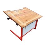 A pine drawing board on adjustable painted metal stand. (42.25in x 35.5in)