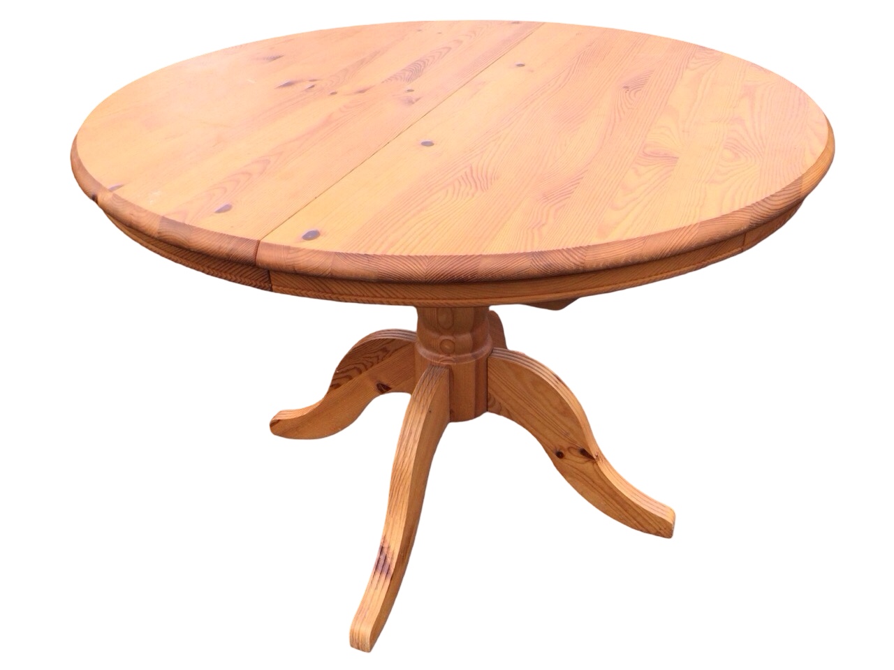 A pine extending dining table with moulded top on bulbous turned column and quadripartite ribbed