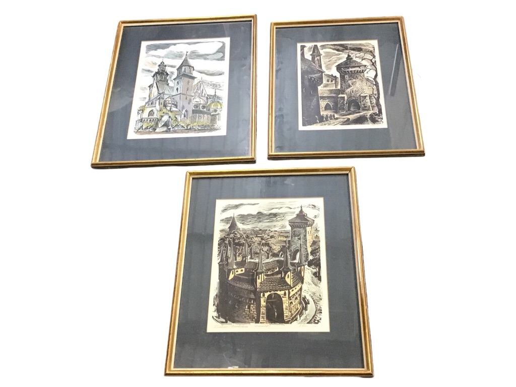 A set of three coloured linocut prints of historic buildings in Krakow - the circular medieval