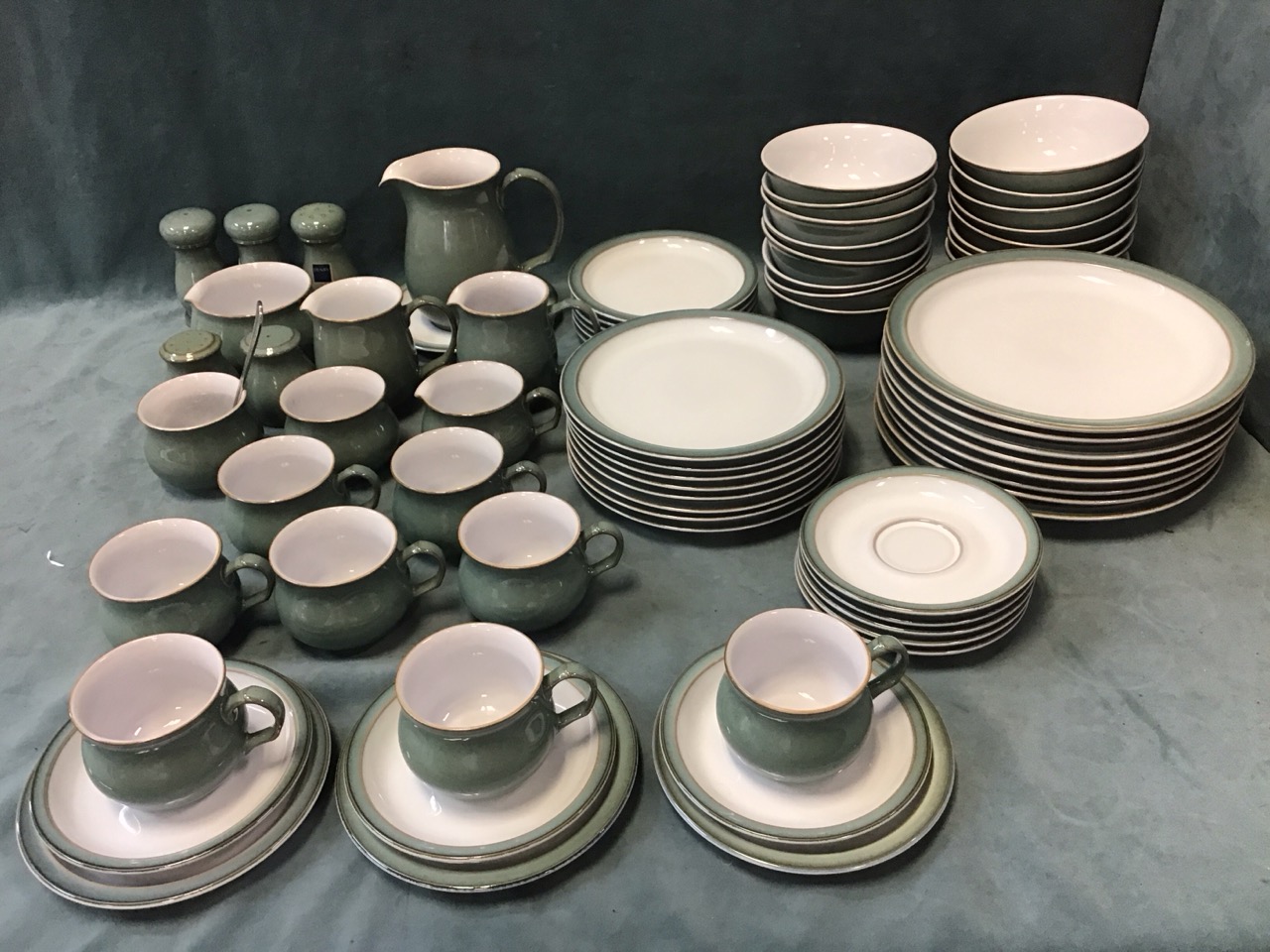 A contemporary eight-piece Denby stoneware dinner & tea service decorated with sea green glaze,