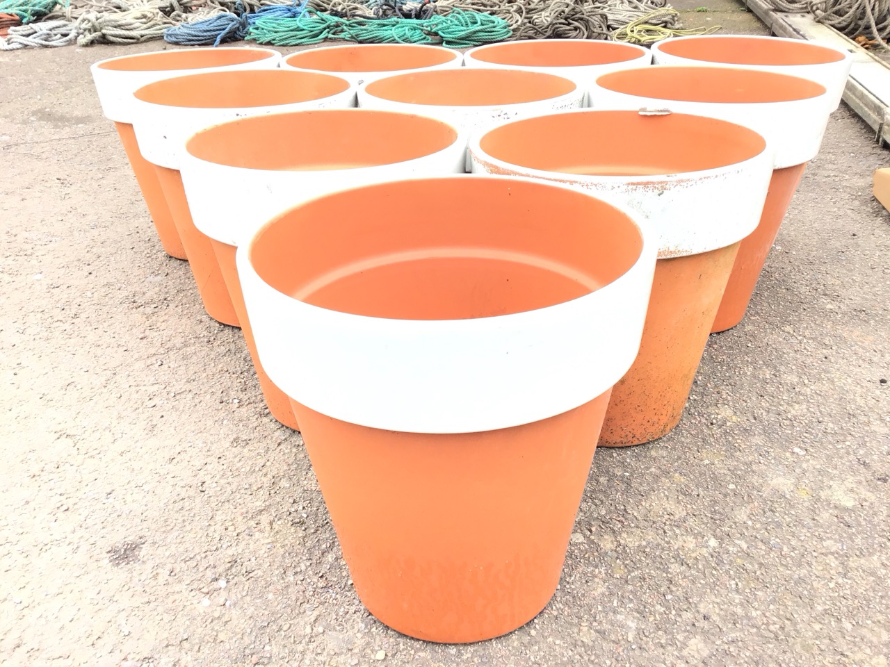 Ten tapering traditional teracotta flower pots with while painted bands to rims. (12.25in) (10) - Image 2 of 3