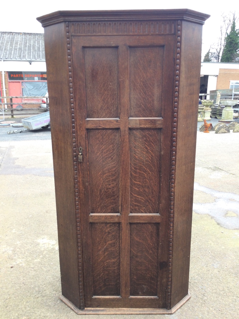 A 50s oak wardrobe with moulded cornice above a fluted frieze and six panelled door enclosing - Image 3 of 3