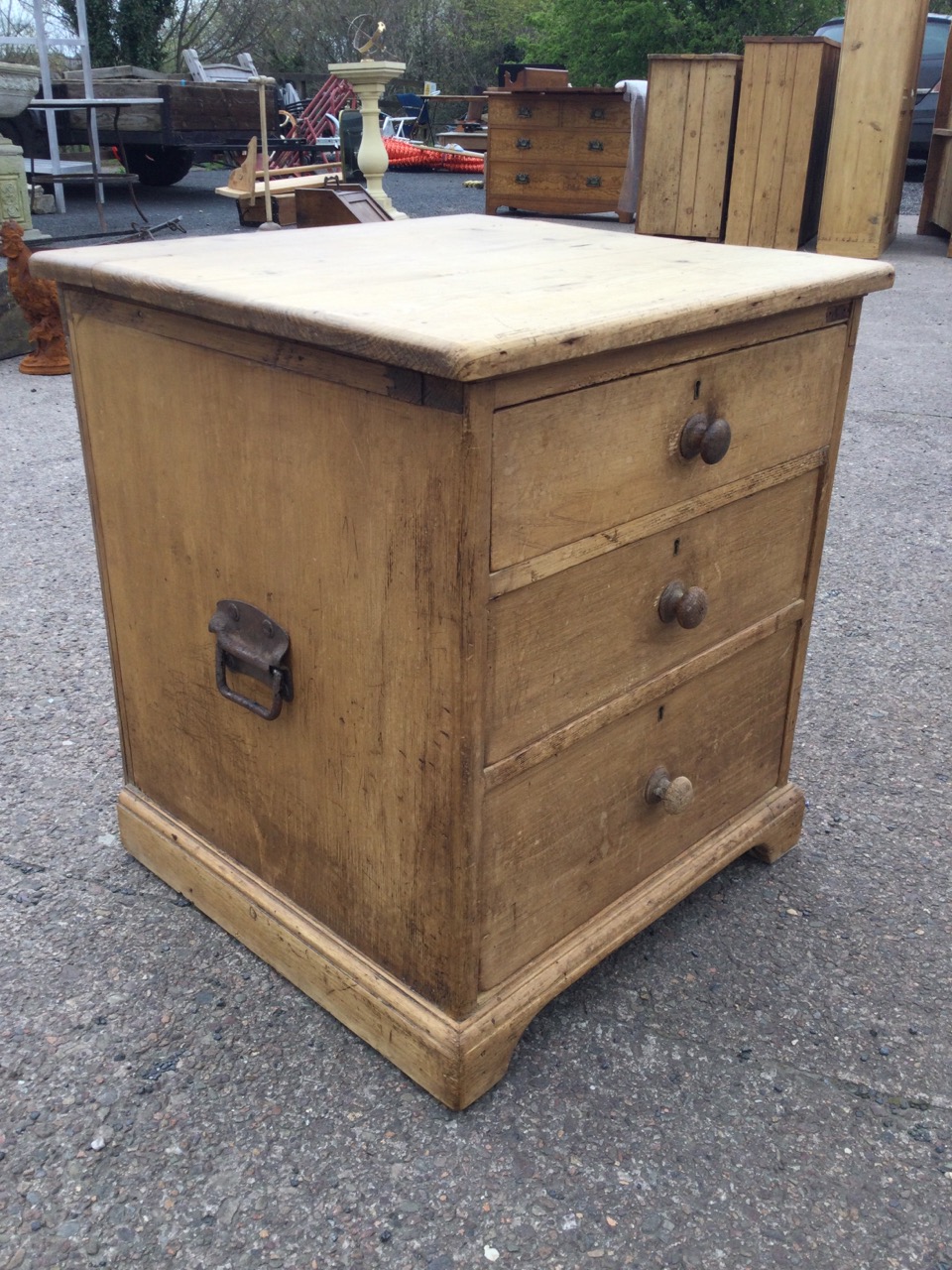 A Victorian pine chest of three graduated knobbed drawers having carriage handles to sides, raised - Image 3 of 3