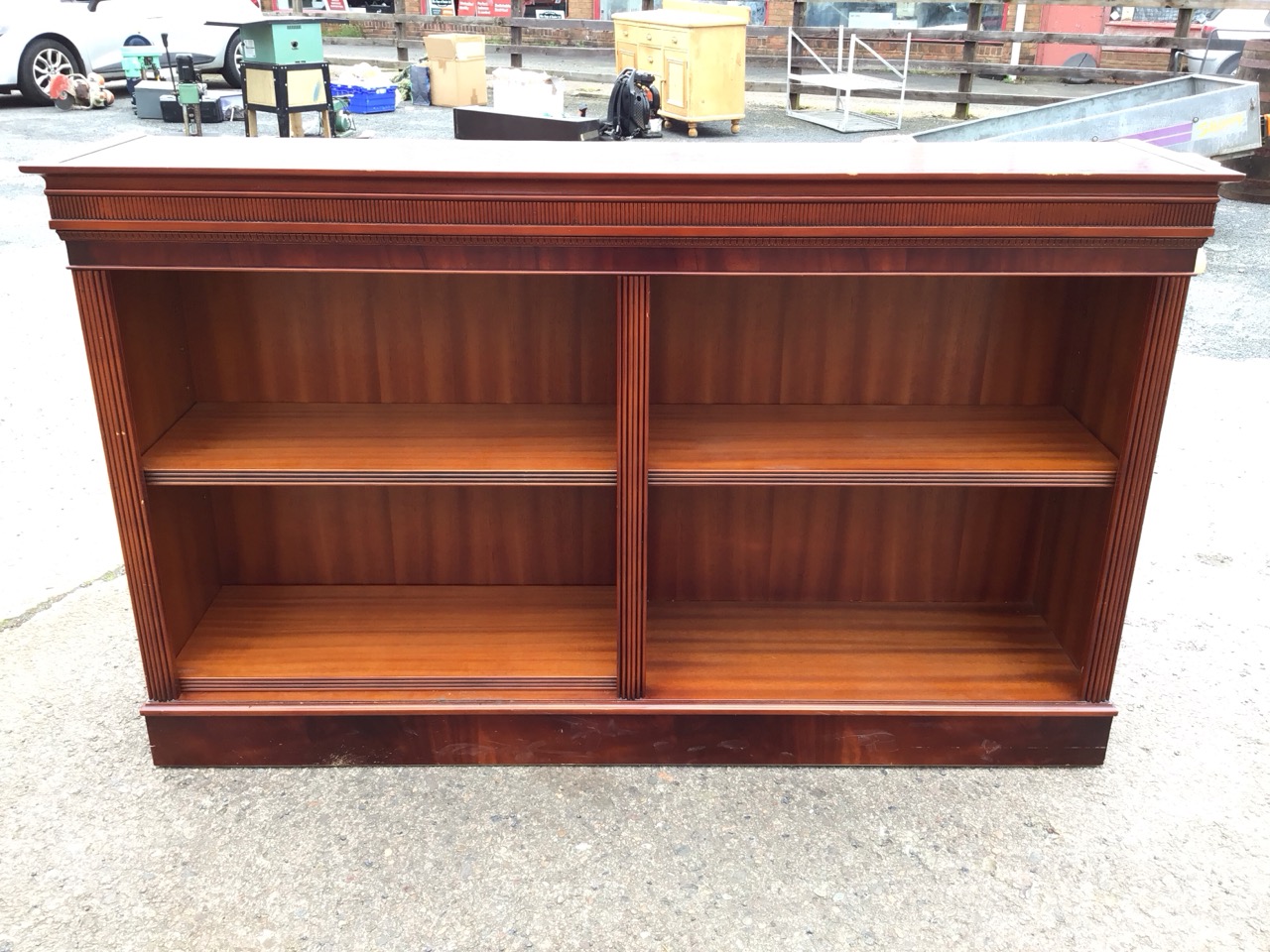A Georgian style mahogany open bookcase with moulded ribbed cornice above two compartments with - Image 2 of 3