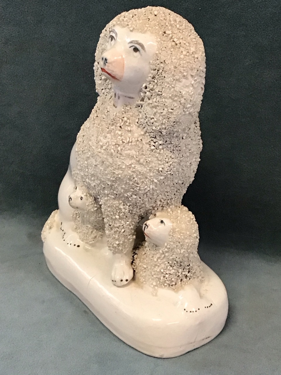 A pair of Victorian Staffordshire flatback ceramic seated poodles, each with two puppies. (6. - Image 2 of 3