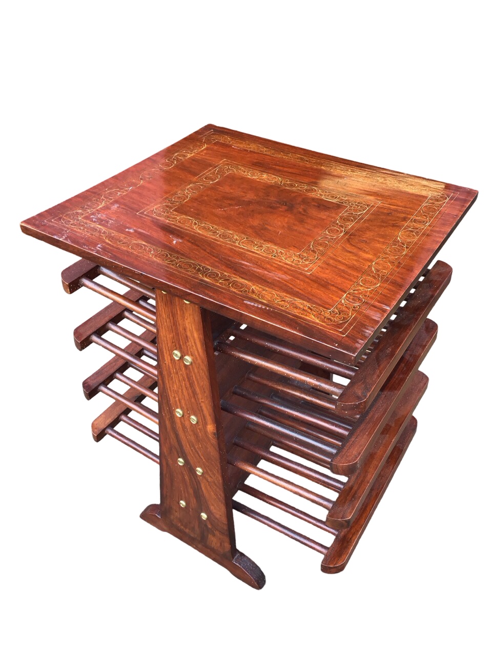 A rosewood coffee table, the top inlaid with two bands of scrolled brass stringing above spindled