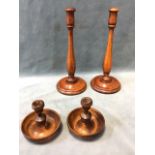 A pair of turned oak candlesticks with baluster columns on circular bases - 12.5in; and a turned