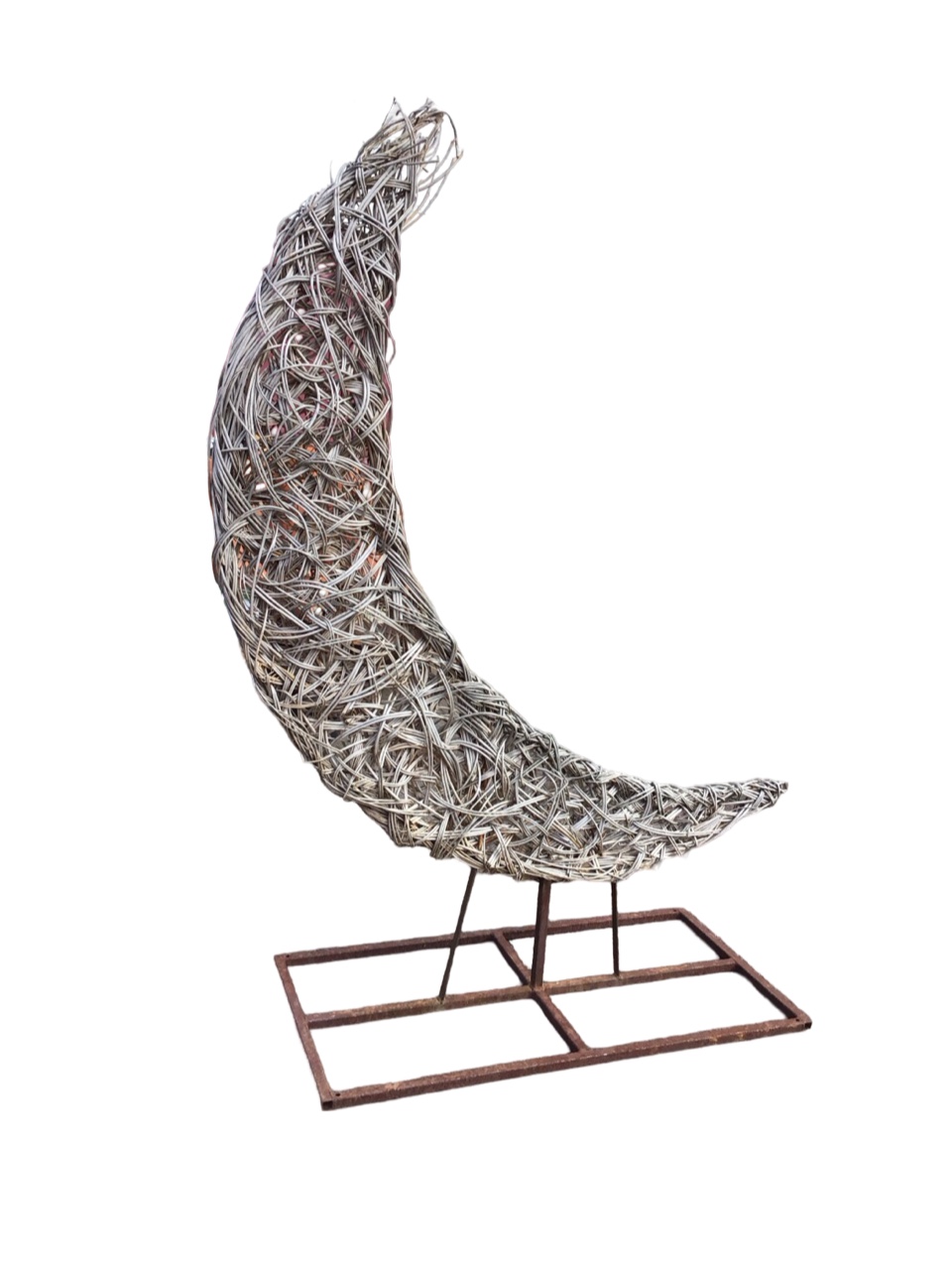 A woven willow crescent shaped sculpture on metal frame with rectangular stand. (80in)