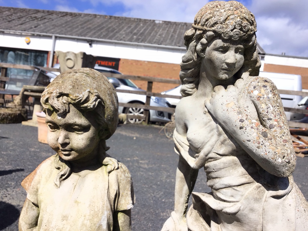 A composition stone garden statue of a modest barefooted girl stand on pebble base; and another - Image 3 of 3